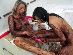 Two Cute Lesbian Girls Going Messy With Liquid Chocolate