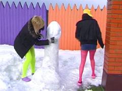 Two Cute Teenage Girls Throwing Snow Balls At Eachother