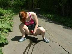 Adorable Redhead Tinkles On Deserted Country Road