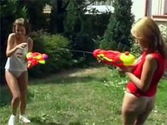 Teens With Big Boobs Having Fun With Watergun In The Garden